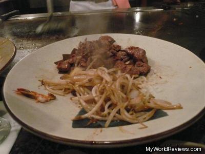 Steak and cooked bean sprouts
