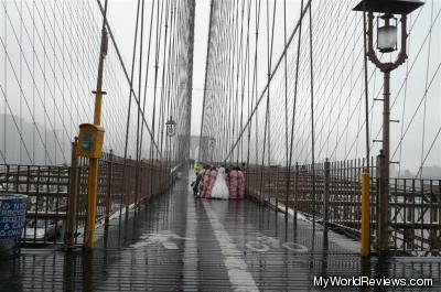 A wedding in the rain on the Brooklyn Bridge