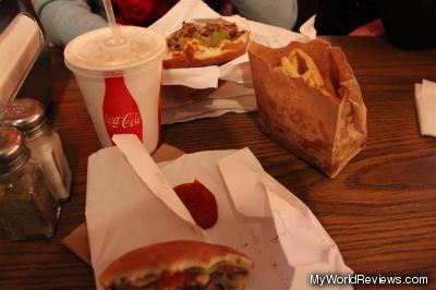 Two burgers, fries, and a milkshake