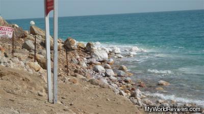 The water and salt-covered rocks at the beach near Ein Gedi