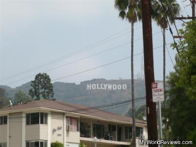 A picture of the hollywood sign from the corner of N Beachwood Drive and Glen Alder Street