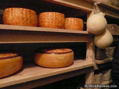 Some of the stored cheese in the cheese cave
