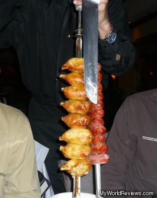 One of the servers with a meat selection