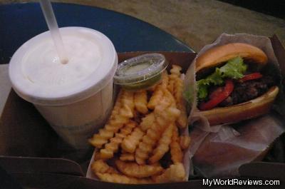 Two burgers, fries, and a milkshake