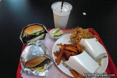 Burgers, sweet potatoes fries, onion rings and a coffee milkshake