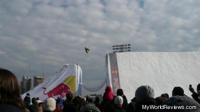 One of the snowboarders mid-jump